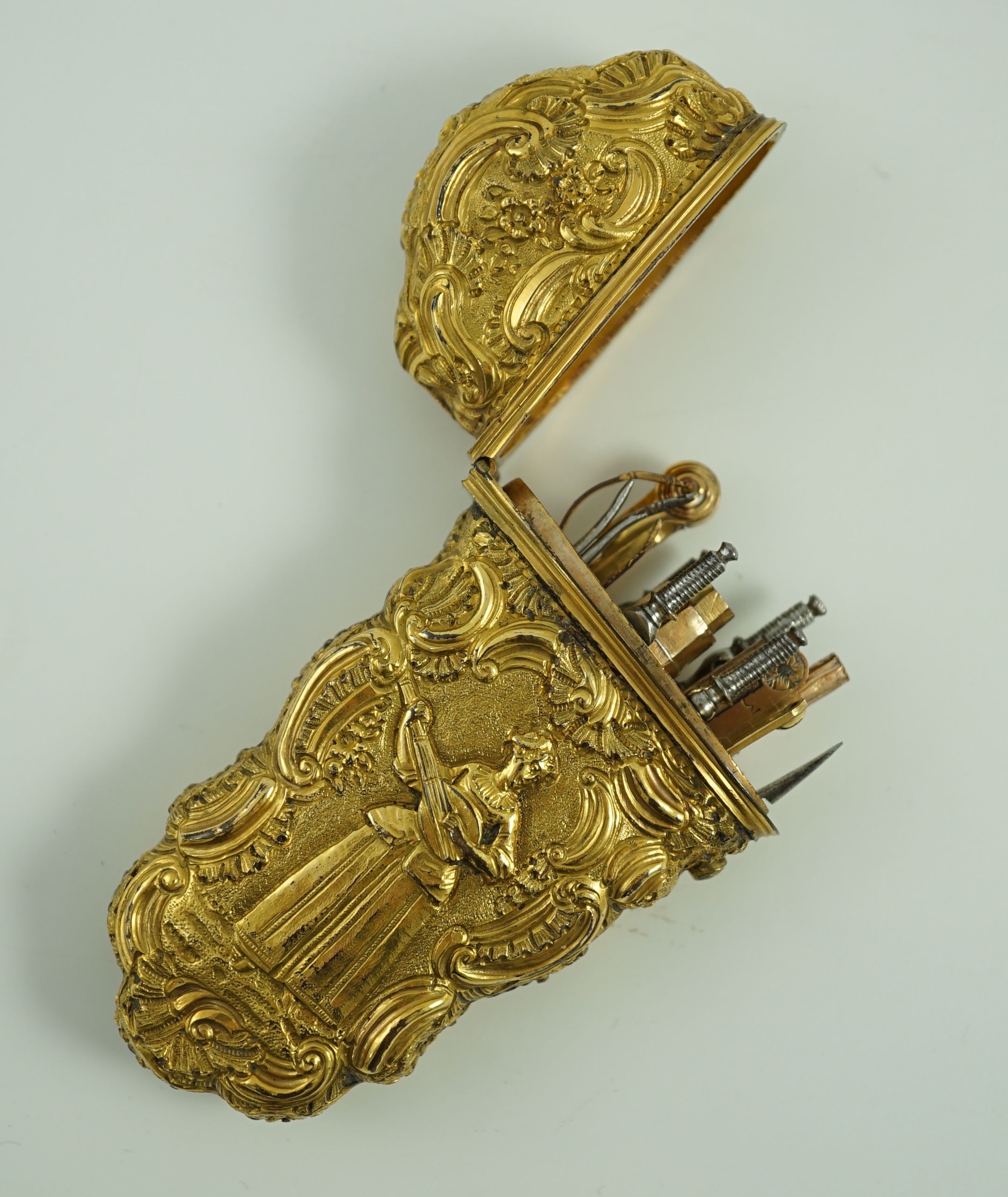 A George III gilt metal etui containing accessories, 10cms high.